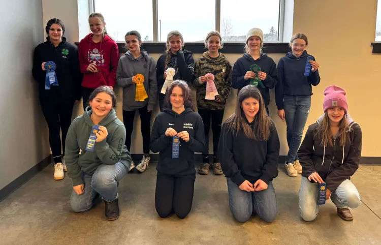 11 kids with prize ribbons