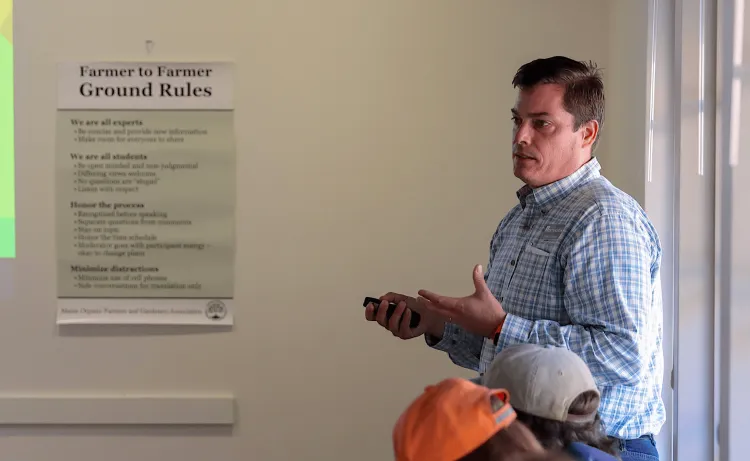Man giving lecture to Farmers