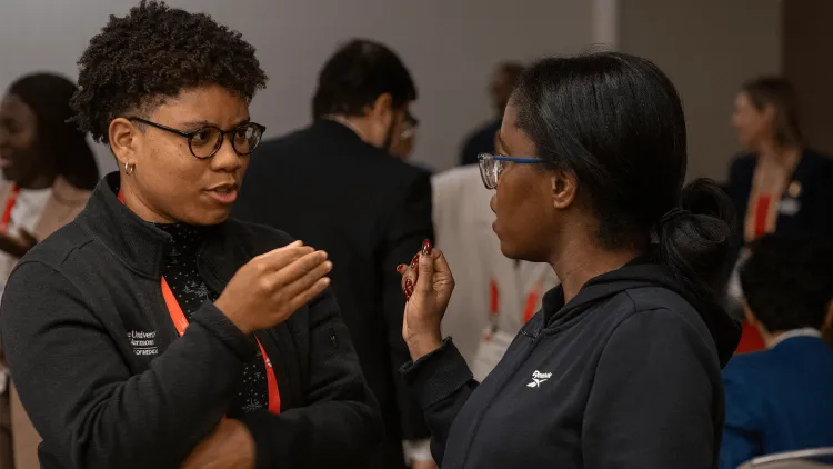 people talking at a conference