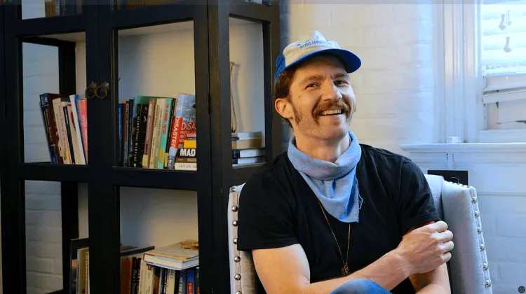 Man in a chair laughing