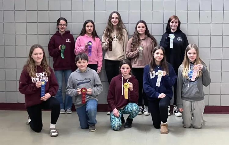 group of 4-h'ers holding ribbons