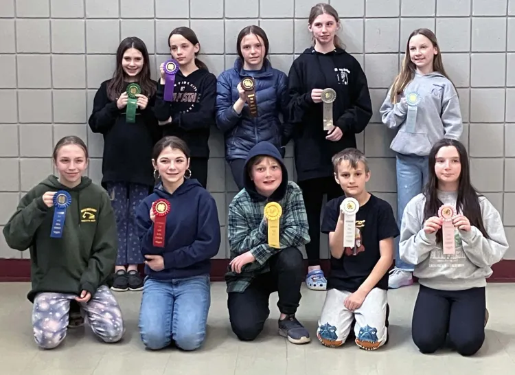 group of 4-h'ers holding ribbons