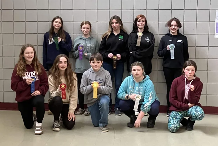 group of 4-h'ers holding ribbons