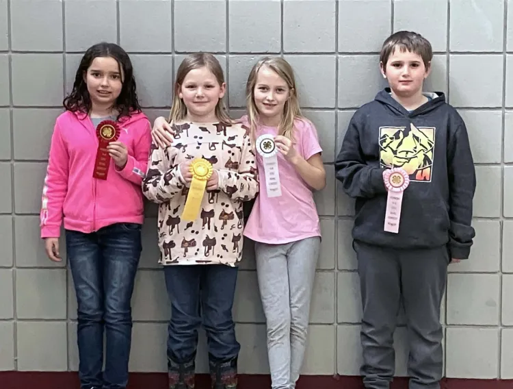 group of 4-h'ers holding ribbons
