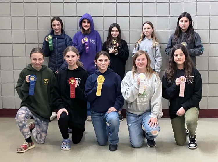 group of 4-h'ers holding ribbons