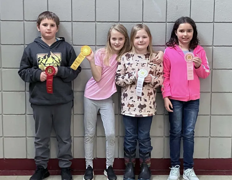 group of 4-h'ers holding ribbons