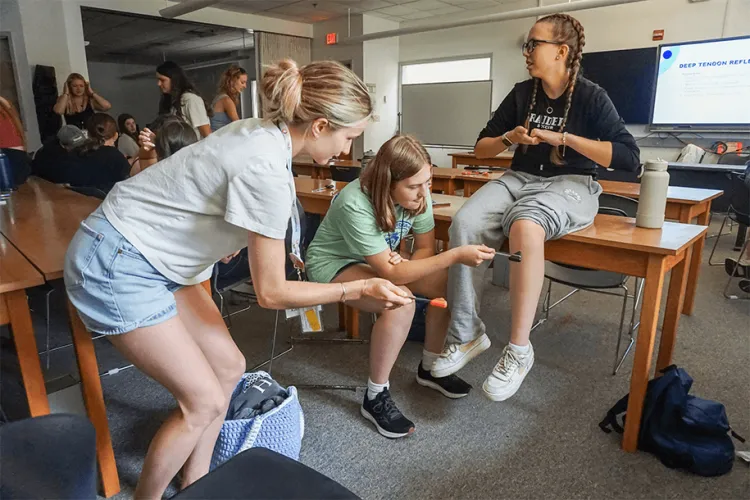 a group of people at a hands-on health careers exercise