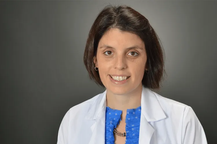 a woman in a white coat