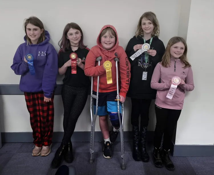 5 kids holding ribbons