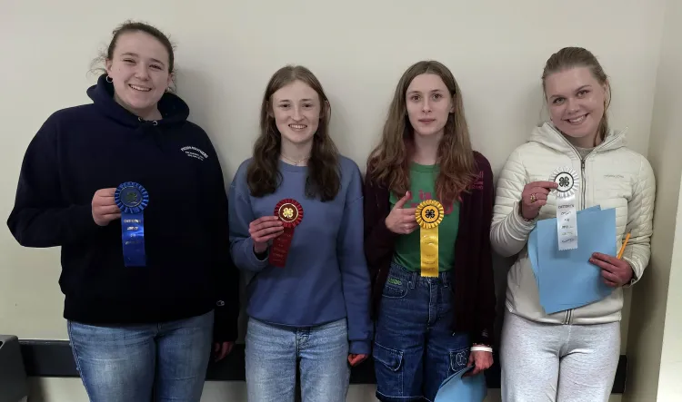 4 kids holding ribbons