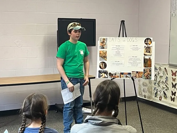 4-H'er at an easel presenting work