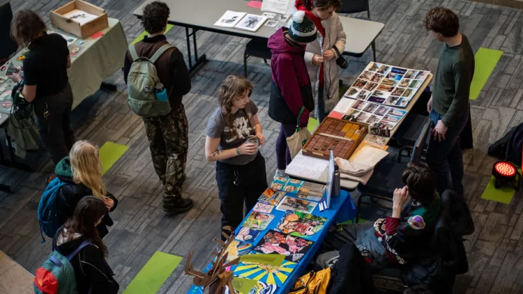 At the center of the event were over twenty student artists tabling with their artwork. 