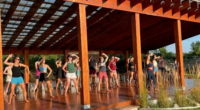 Students in an outdoor dance class