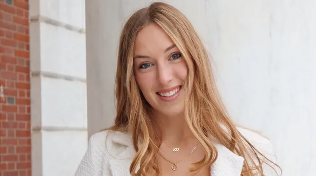 portrait of young woman in white coat