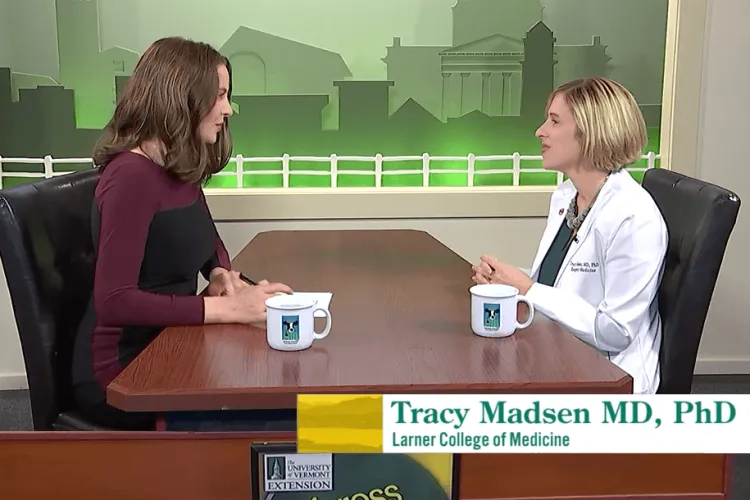 two woman talking across a table