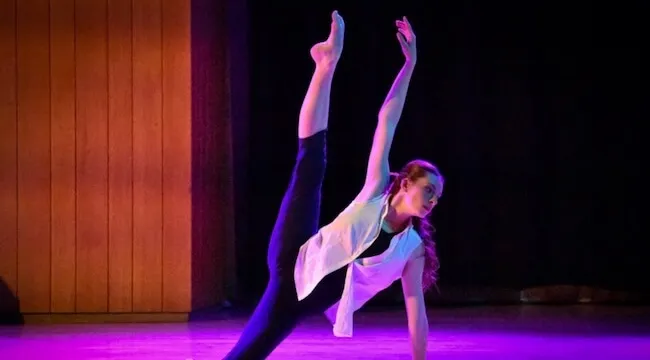 dancer performing in colored light