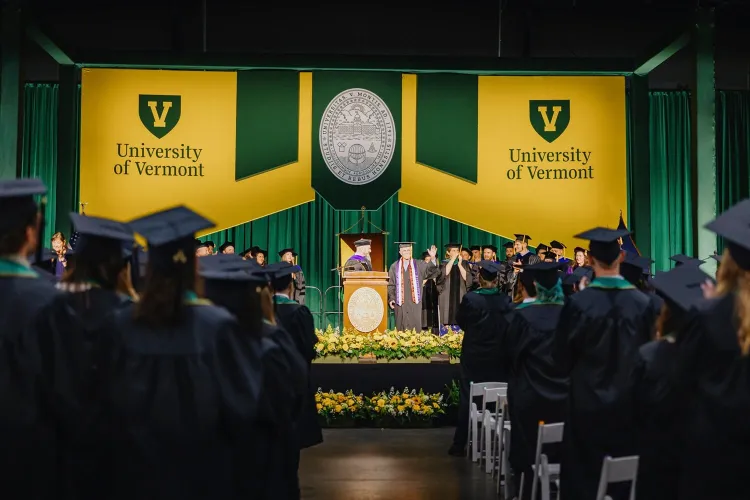 Dave Kaufman standing on the stage at the RSENR Commencement ceremony in May 2025 waving to a cheering crowd