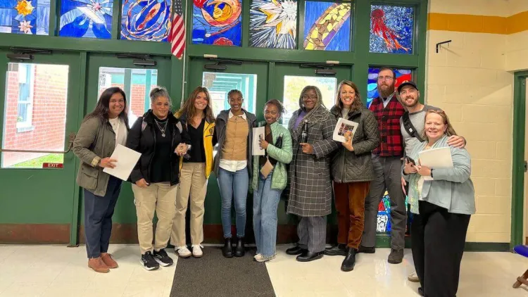 Community Schools team members gathered in a school
