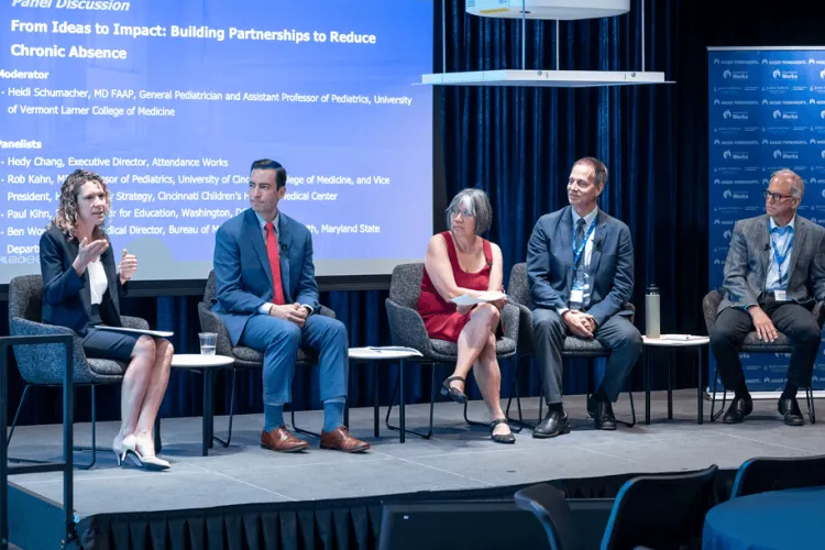 a panel of speakers at a conference
