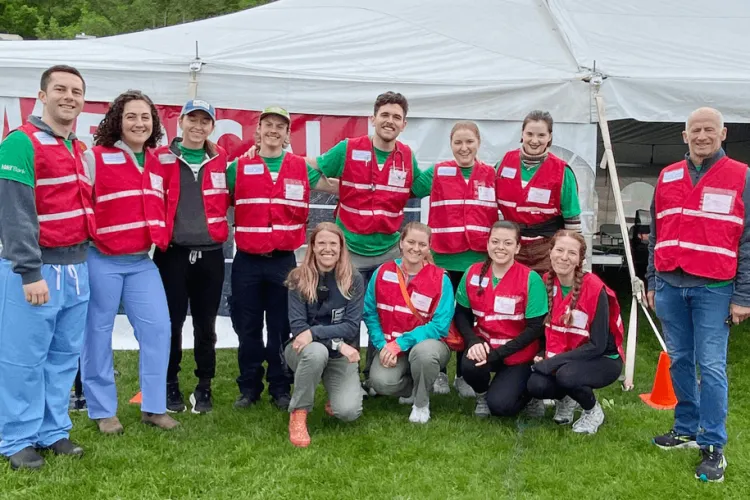 a group of medical tent volunteers at a run