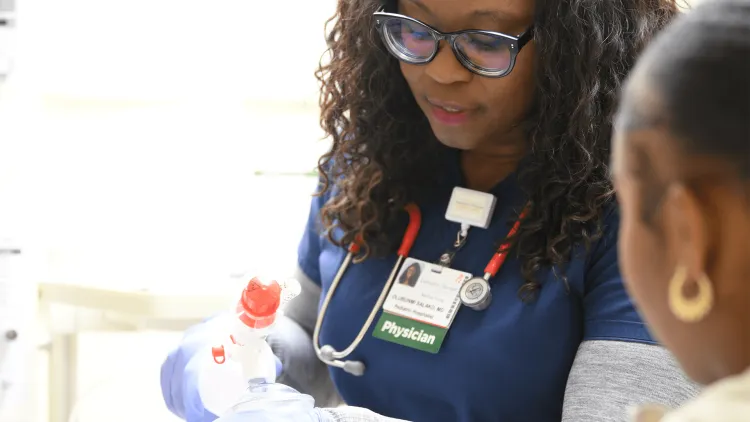 2 women practicing intubation on a manikin