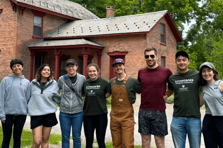 a group of people posing in a line