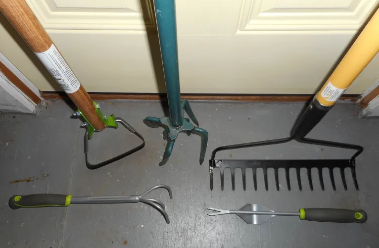 weeding tools leaning against a door