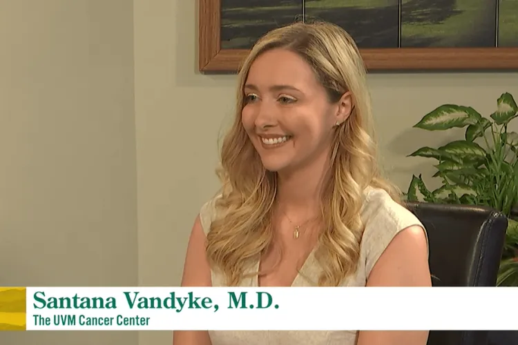a woman at a table on a TV set