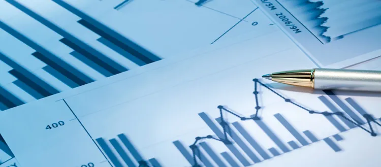 Image of data charts and a pen