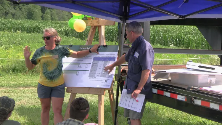 Amber Machia and Kurt Cotanch giving a presentation on forage preservation.