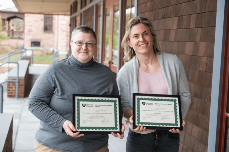 Pamela "Flask" Gude and Laura Edling holding their awards