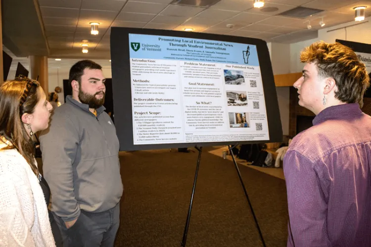 Students share information about their project for the Center of Community News