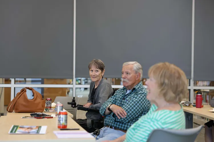 Workshop attendees have a conversation with one another.