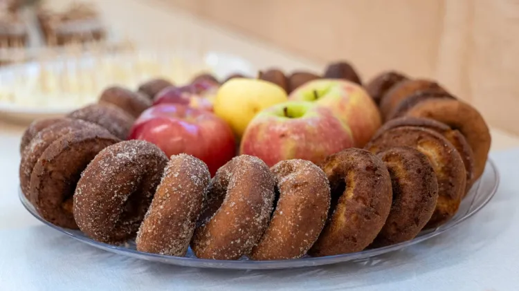 Apples and donuts on a platter