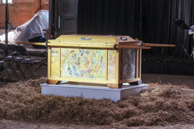 The Ark of Hope, a large wooden structure painted with many illustrations