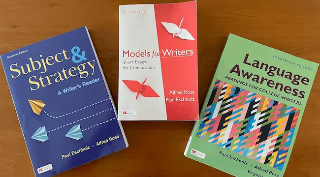three books on a desk