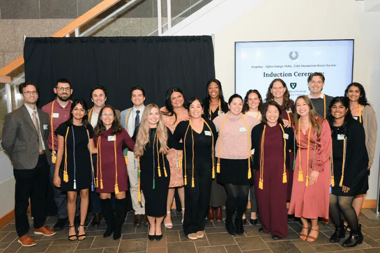 a group of people posing at an awards ceremony