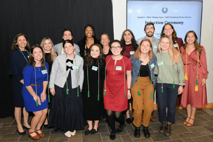 a group of people posing at an awards ceremony