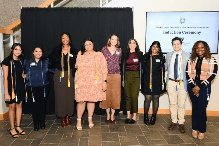 a group of people posing at an awards ceremony