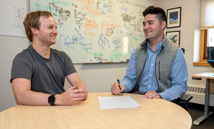 ECE Assistant Professor Sam Chevalier working with on of his graduate student researchers