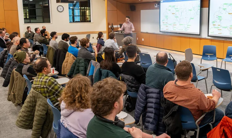 Assistant Professor Sam Chevalier presents at a recent CREATE symposium on the impact of EVs on Vermont's electrical grid.