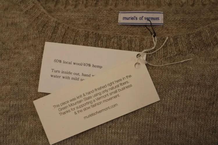 Tag reading: This piece was knit & hand-finished right here in the Green Mountain State using only natural fibers. Thanks for supporting a Vermont small business & the slow fashion movement.