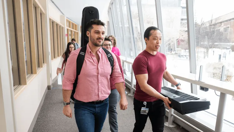 musicians walking in a hallway