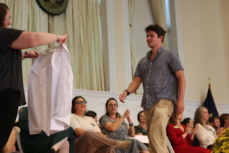Nursing student about to receive white coat