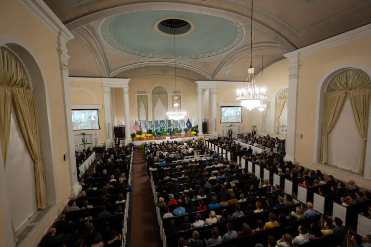Pews at Ira Allen Chapel packed with people