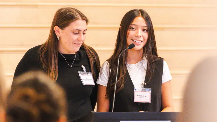 Women in Business student leaders address the crowd
