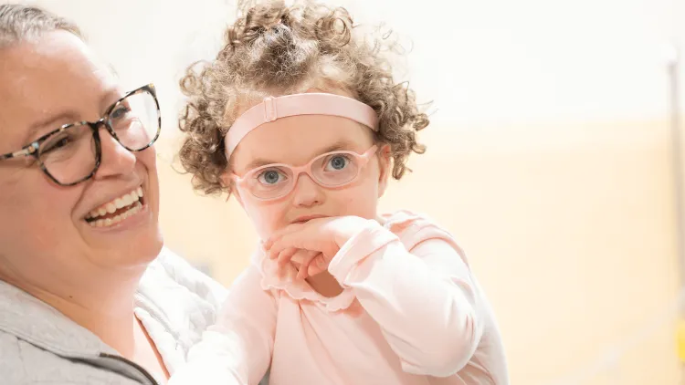 a mother holding a child