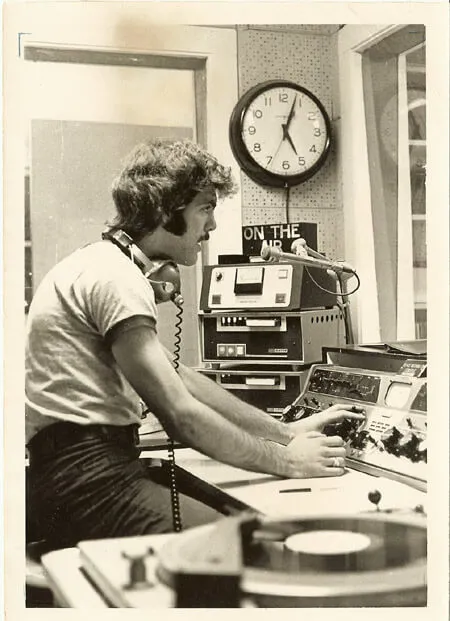 Photo of a student DJ at the booth in WRUV several decades ago. 