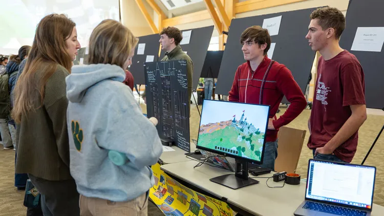 Students participating in a computer science fair