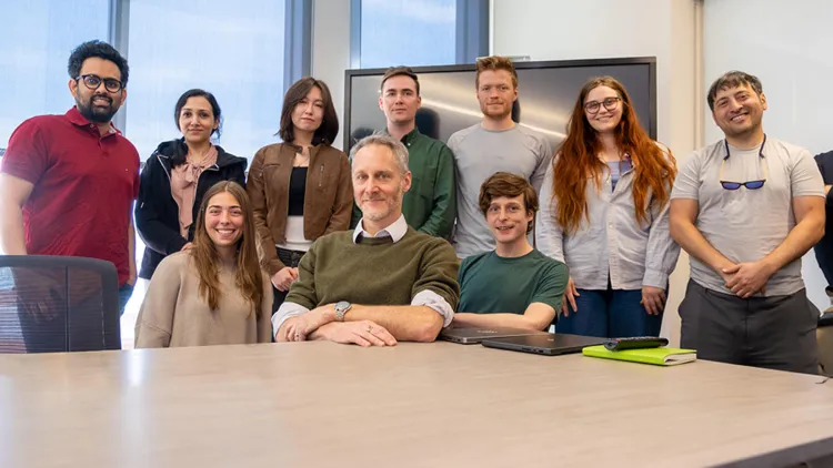 Group of people posing at a table